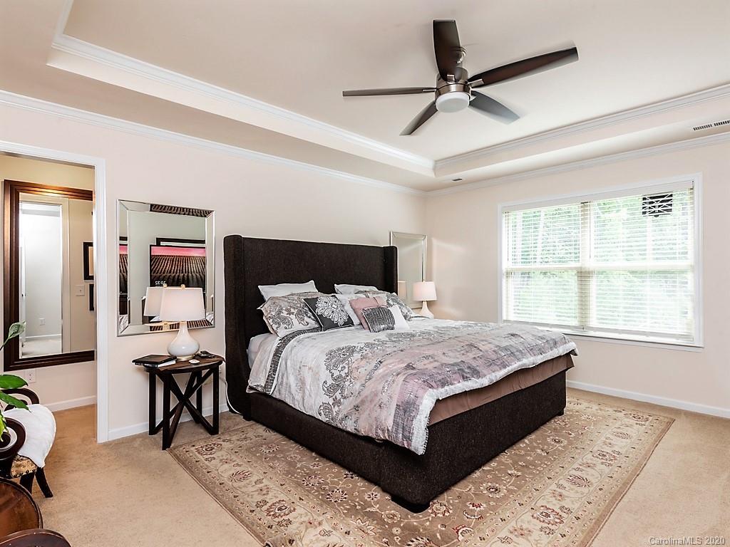 7004 Fallondale Road Waxhaw, NC 28173 - Photo 22 of 37 a bedroom with a bed and a table