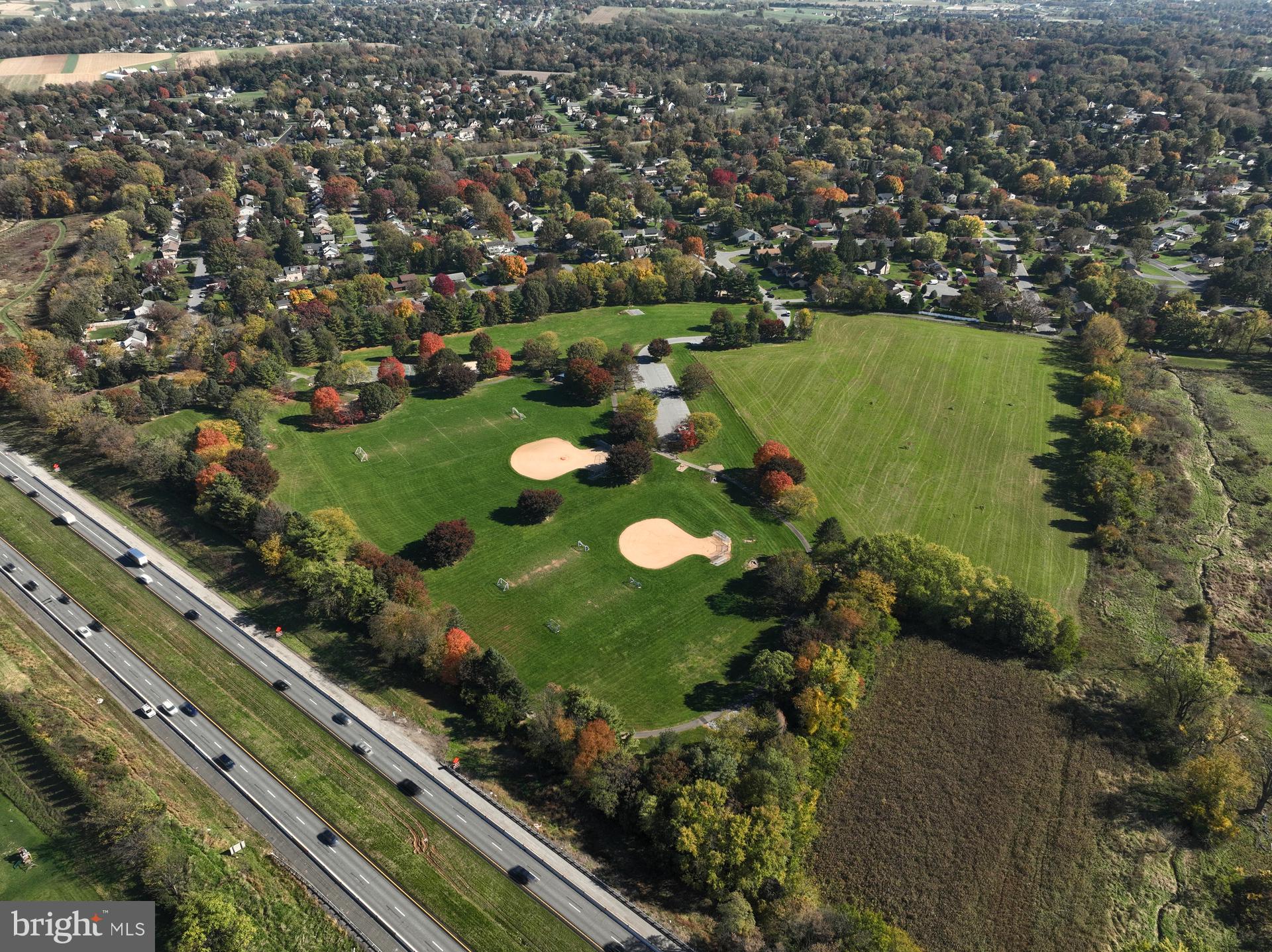 1100 Bluegrass Road, Unit DEVONSHIRE Lancaster, PA 17601 - Photo 54 of 64 an aerial view of a golf course with parking space