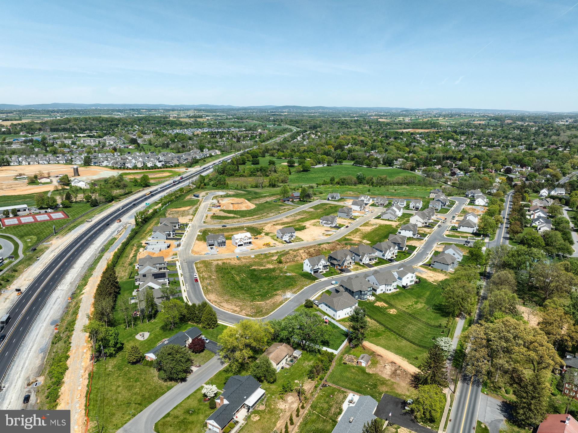 1100 Bluegrass Road, Unit DEVONSHIRE Lancaster, PA 17601 - Photo 64 of 64 an aerial view of residential houses with outdoor space