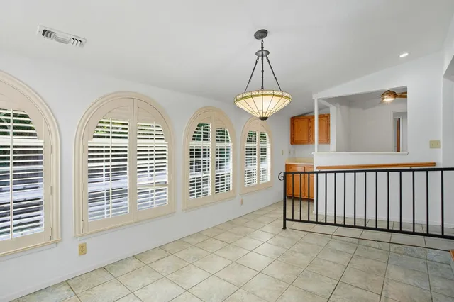 a view of empty room with windows