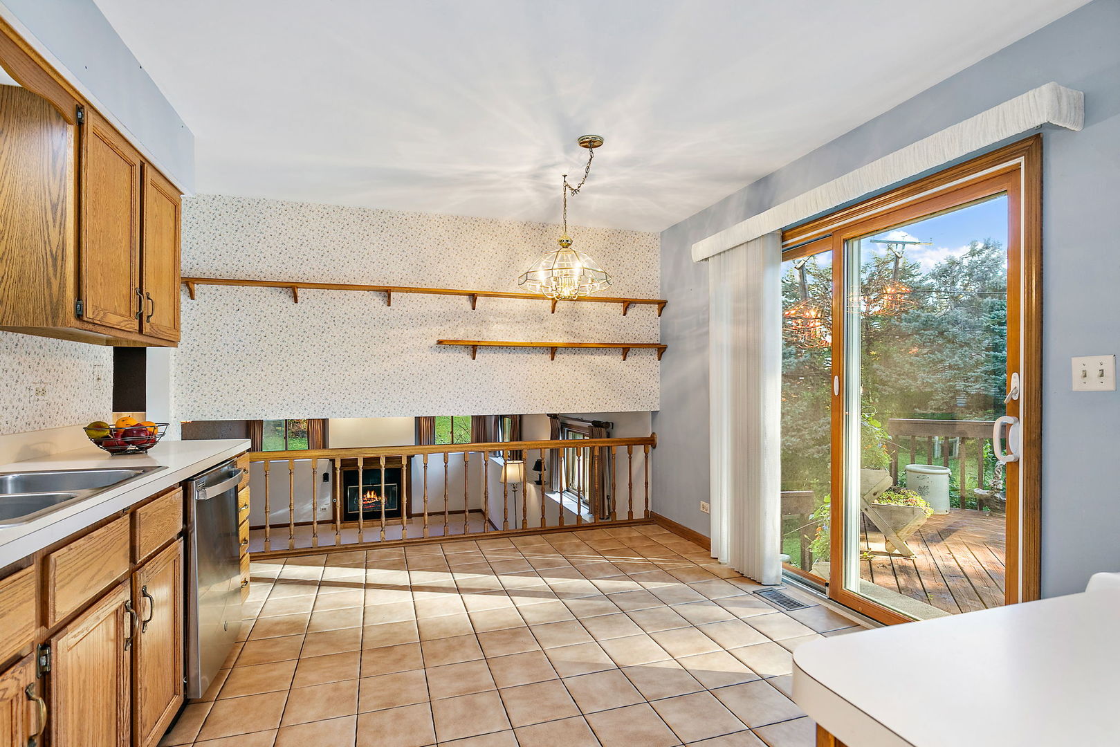 775 Stephen Drive Palatine, IL 60067 - Photo 5 of 19 a open kitchen with granite countertop a sink dishwasher a stove and a dining table with the view of kitchen