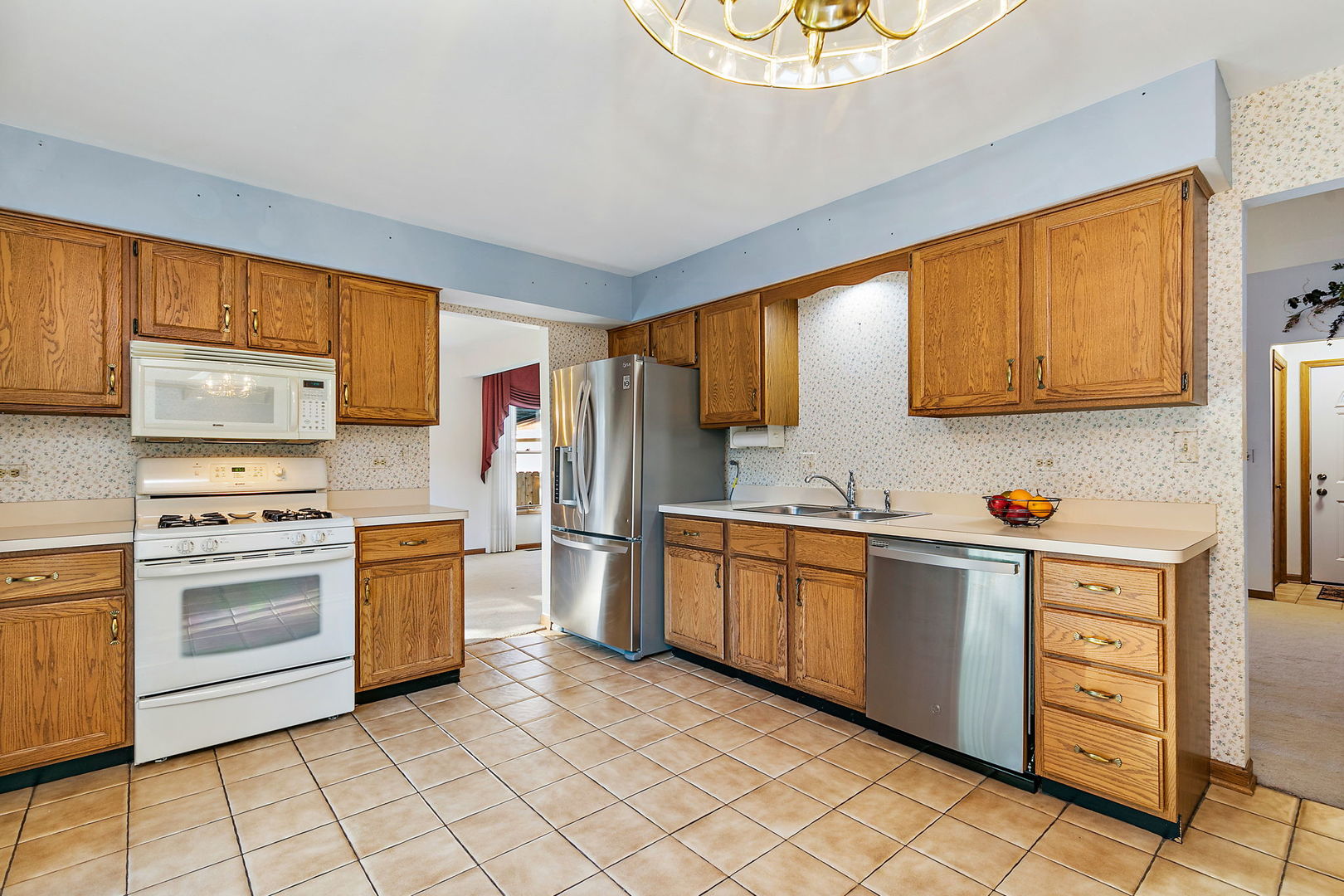 775 Stephen Drive Palatine, IL 60067 - Photo 7 of 19 a kitchen with stainless steel appliances granite countertop a stove a sink dishwasher and a refrigerator