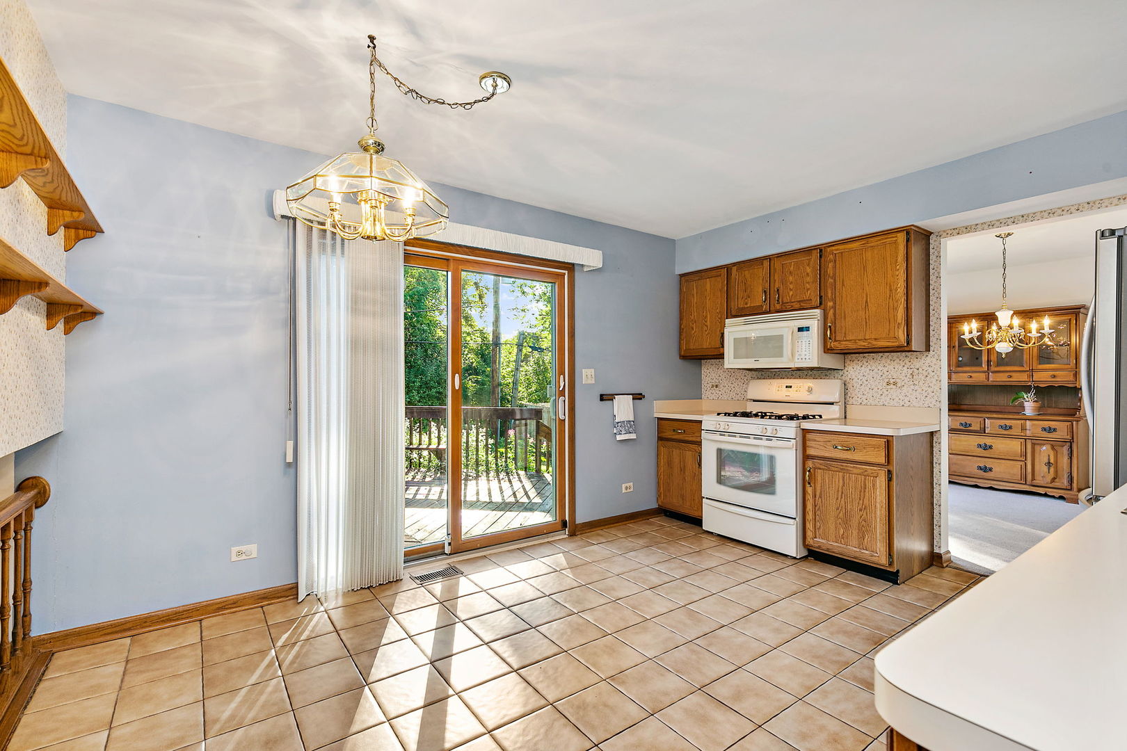 775 Stephen Drive Palatine, IL 60067 - Photo 8 of 19 a kitchen with stainless steel appliances granite countertop a stove and a refrigerator