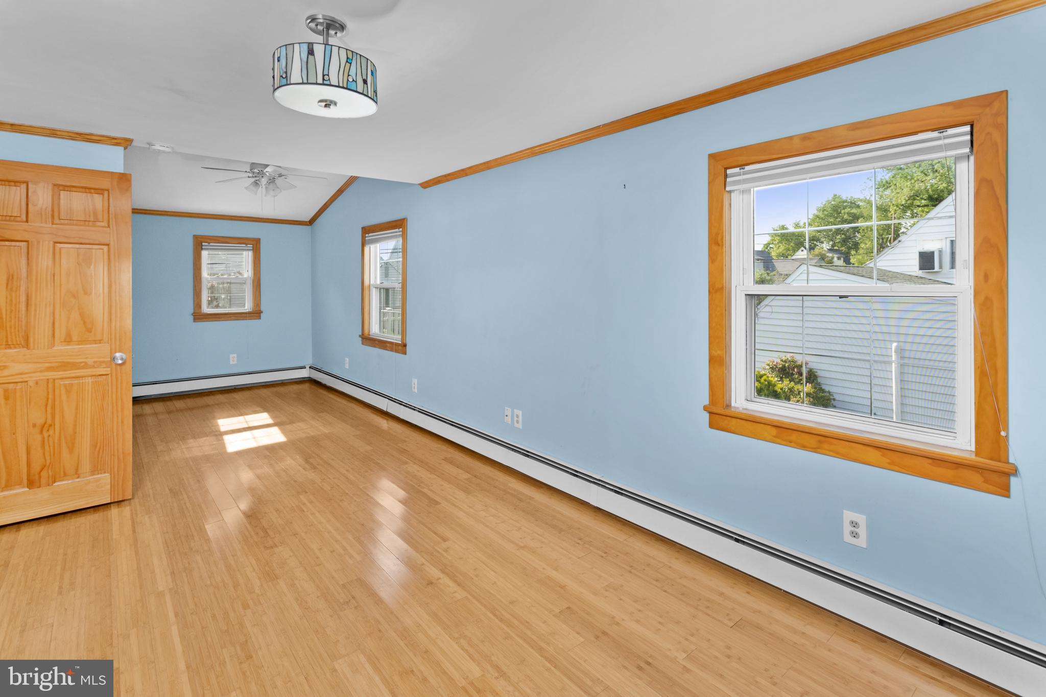 23 Cotton Road Levittown, PA 19057 - Photo 24 of 36 a view of empty room with window and wooden floor