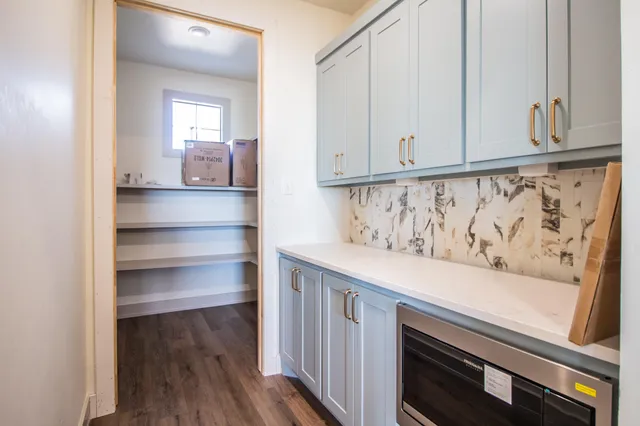 a view of an entryway with wooden floor