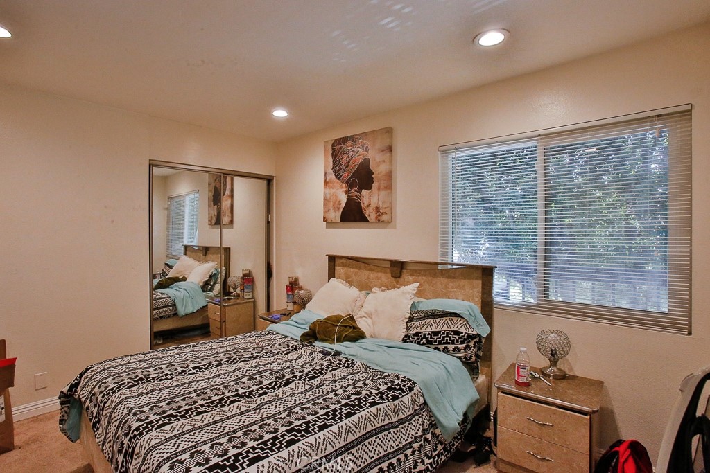 6637 Caro Street Paramount, CA 90723 - Photo 12 of 61 a bedroom with a large bed and a window