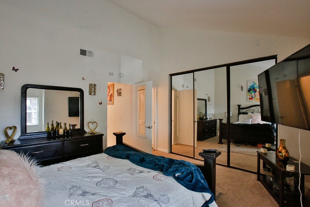 6637 Caro Street Paramount, CA 90723 - Photo 15 of 61 a bedroom with a bed and a flat tv screen on dresser