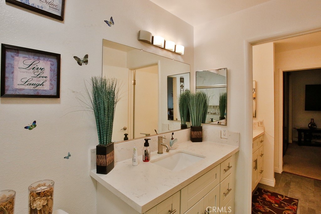 6637 Caro Street Paramount, CA 90723 - Photo 20 of 61 a bathroom with a sink and a mirror