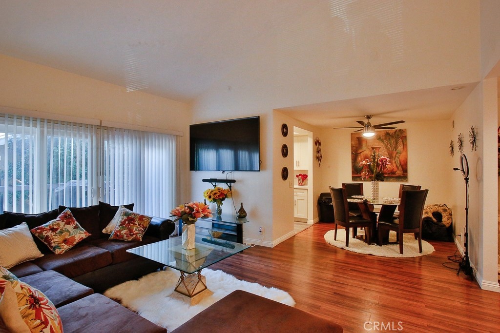 6637 Caro Street Paramount, CA 90723 - Photo 2 of 61 a living room with furniture and wooden floor