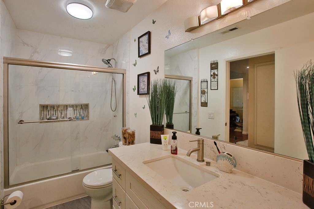 6637 Caro Street Paramount, CA 90723 - Photo 21 of 61 a bathroom with a sink toilet and shower