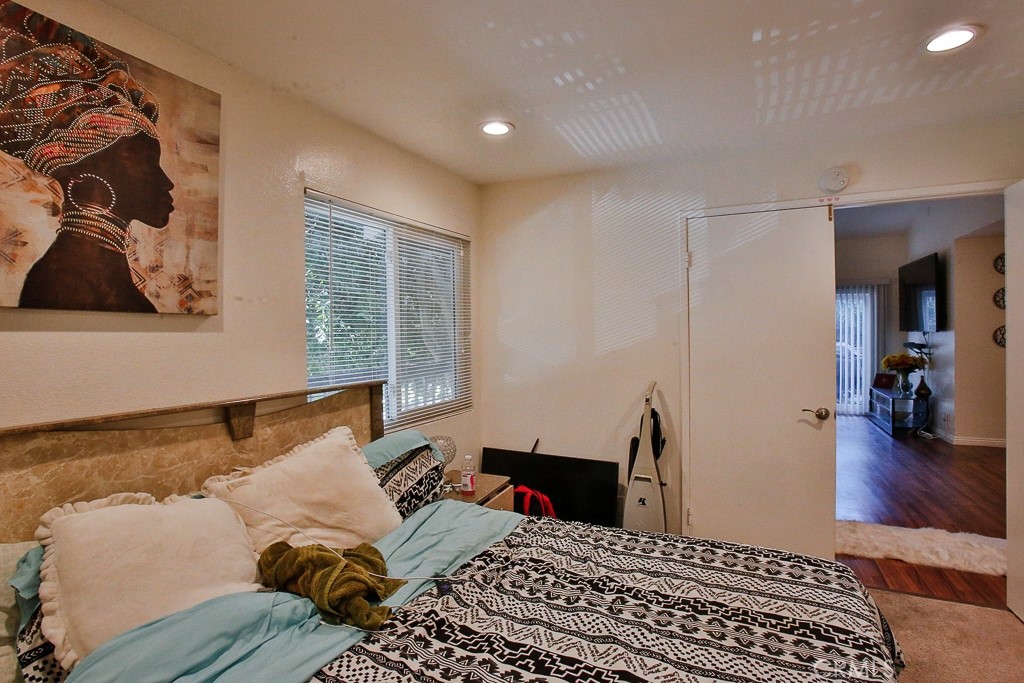 6637 Caro Street Paramount, CA 90723 - Photo 3 of 61 a bed room with a bed and a window