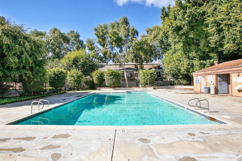 6637 Caro Street Paramount, CA 90723 - Photo 31 of 61 a view of a swimming pool with a yard