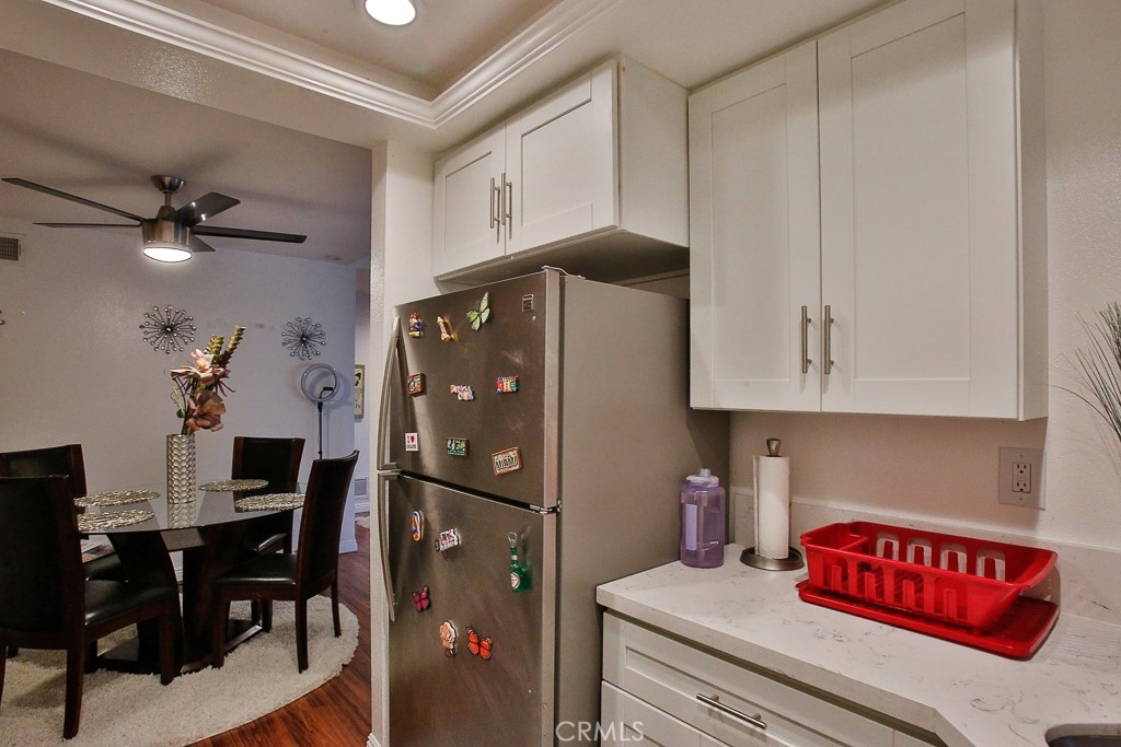 6637 Caro Street Paramount, CA 90723 - Photo 36 of 61 a kitchen with stainless steel appliances granite countertop a refrigerator and a stove top oven