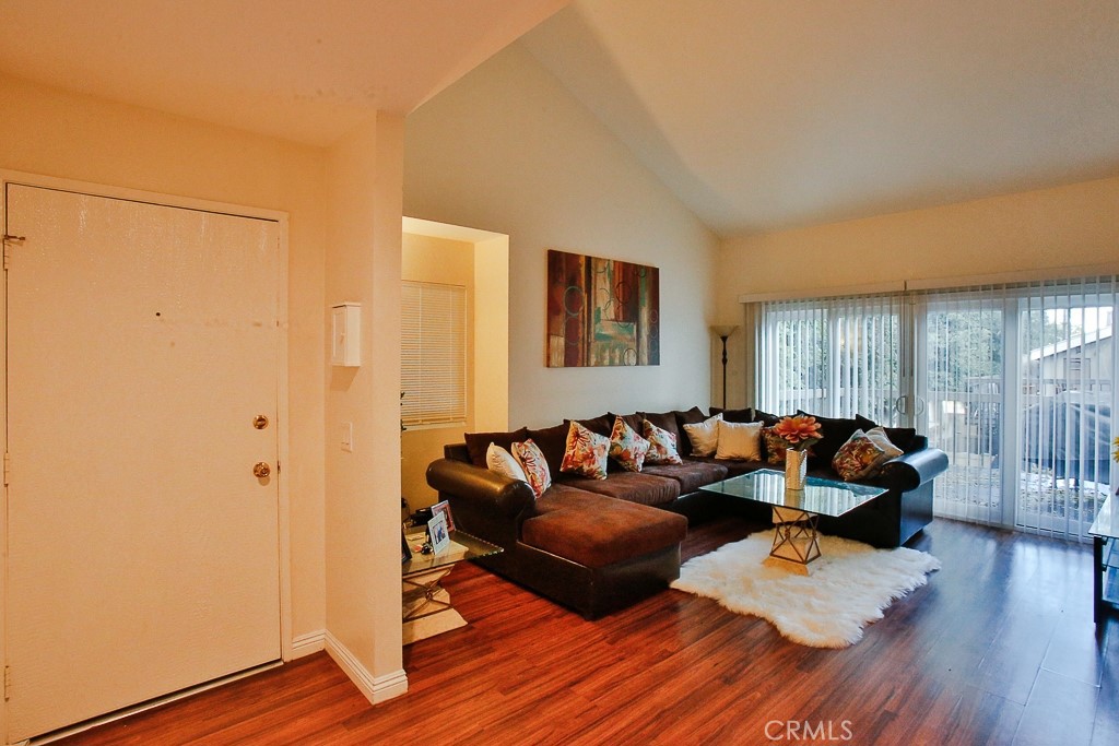 6637 Caro Street Paramount, CA 90723 - Photo 40 of 61 a living room with furniture and wooden floor