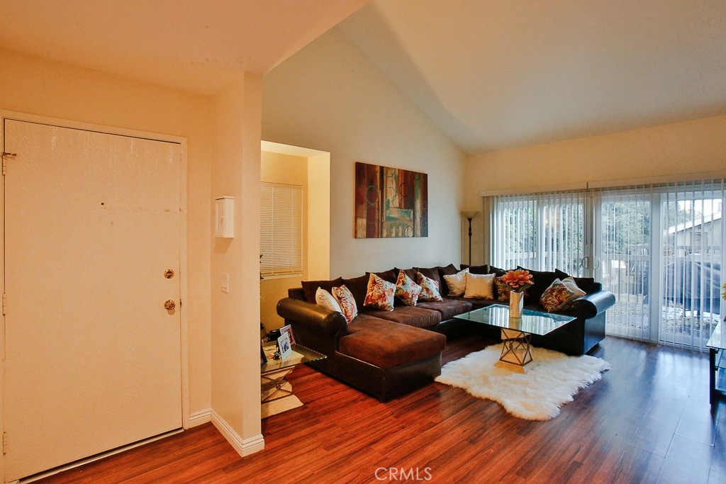 6637 Caro Street Paramount, CA 90723 - Photo 4 of 61 a living room with furniture and wooden floor