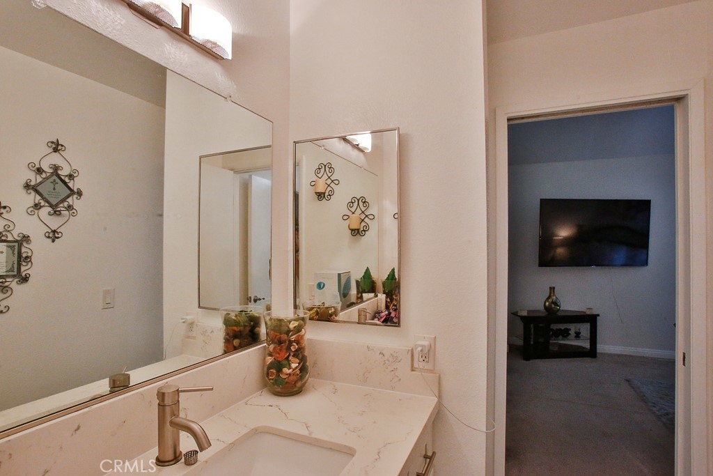 6637 Caro Street Paramount, CA 90723 - Photo 43 of 61 a living room with furniture and a flat screen tv
