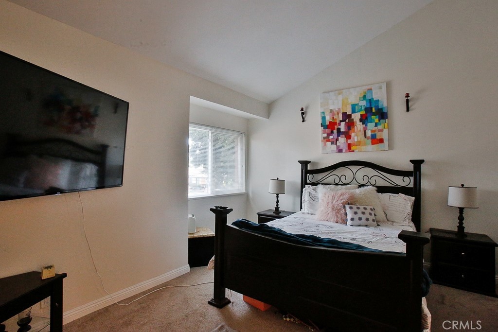 6637 Caro Street Paramount, CA 90723 - Photo 45 of 61 a bedroom with a bed and a flat screen tv