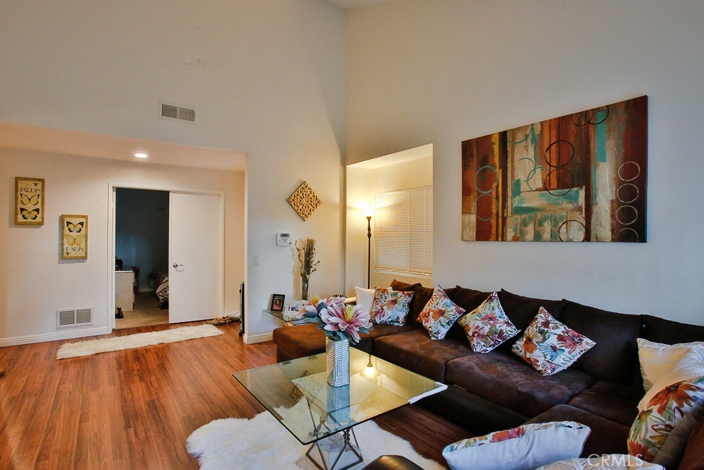 6637 Caro Street Paramount, CA 90723 - Photo 5 of 61 a living room with furniture and wooden floor