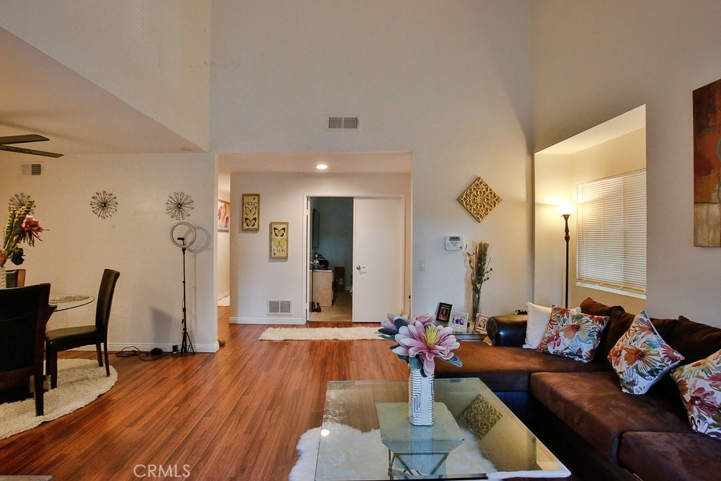 6637 Caro Street Paramount, CA 90723 - Photo 6 of 61 a living room with furniture and wooden floor