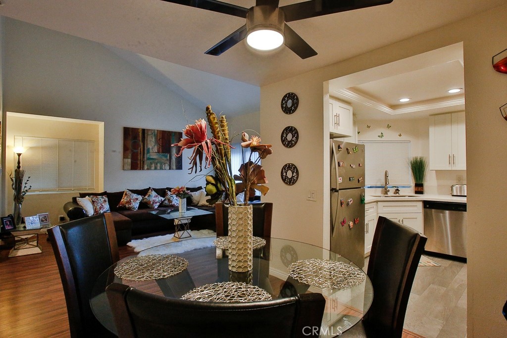 6637 Caro Street Paramount, CA 90723 - Photo 8 of 61 a dining room with furniture and wooden floor