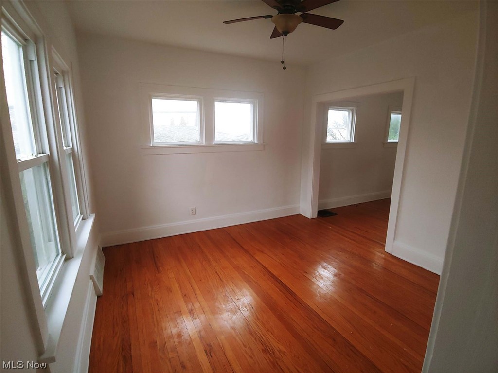 1464 Sherbrook Road Cleveland, OH 44121 - Photo 6 of 15 Unfurnished room featuring dark hardwood / wood-style floors and ceiling fan