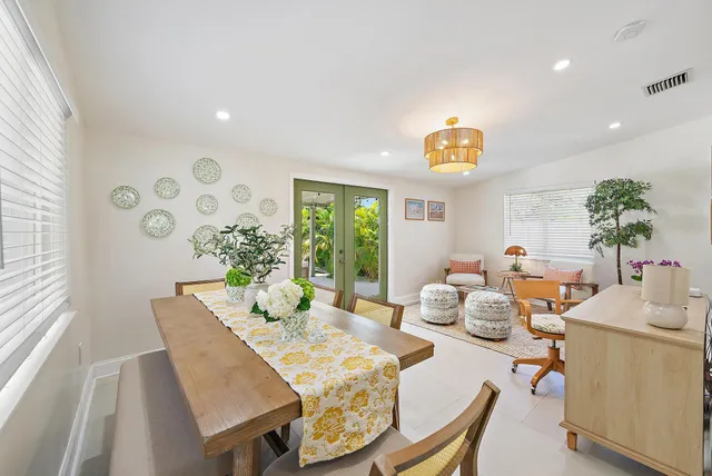 a living room with furniture and potted plant