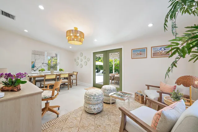 a living room with furniture and a potted plant