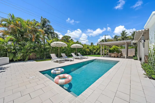 a view of a swimming pool with a patio