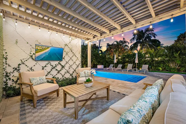 a outdoor living space with furniture and a potted plant