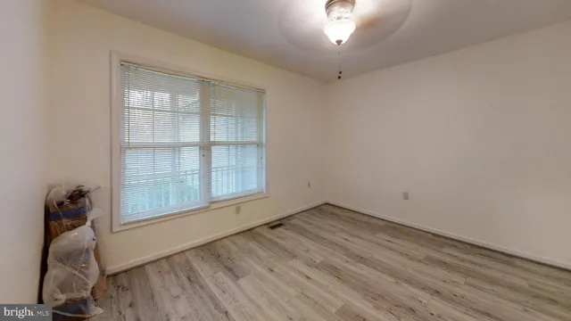 a view of a chairs and table in backyard
