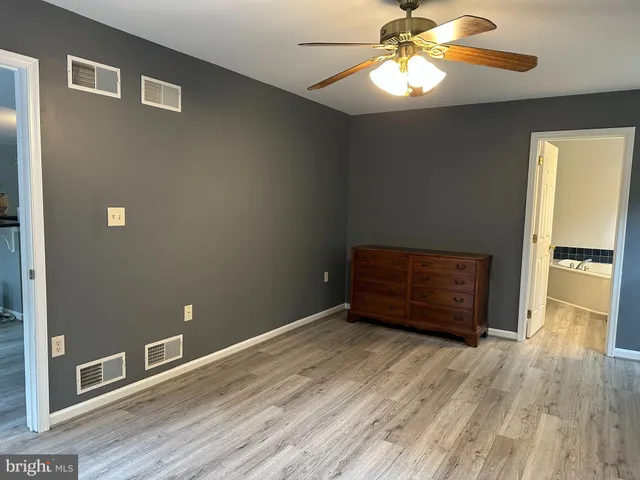 a view of a house with a yard and deck