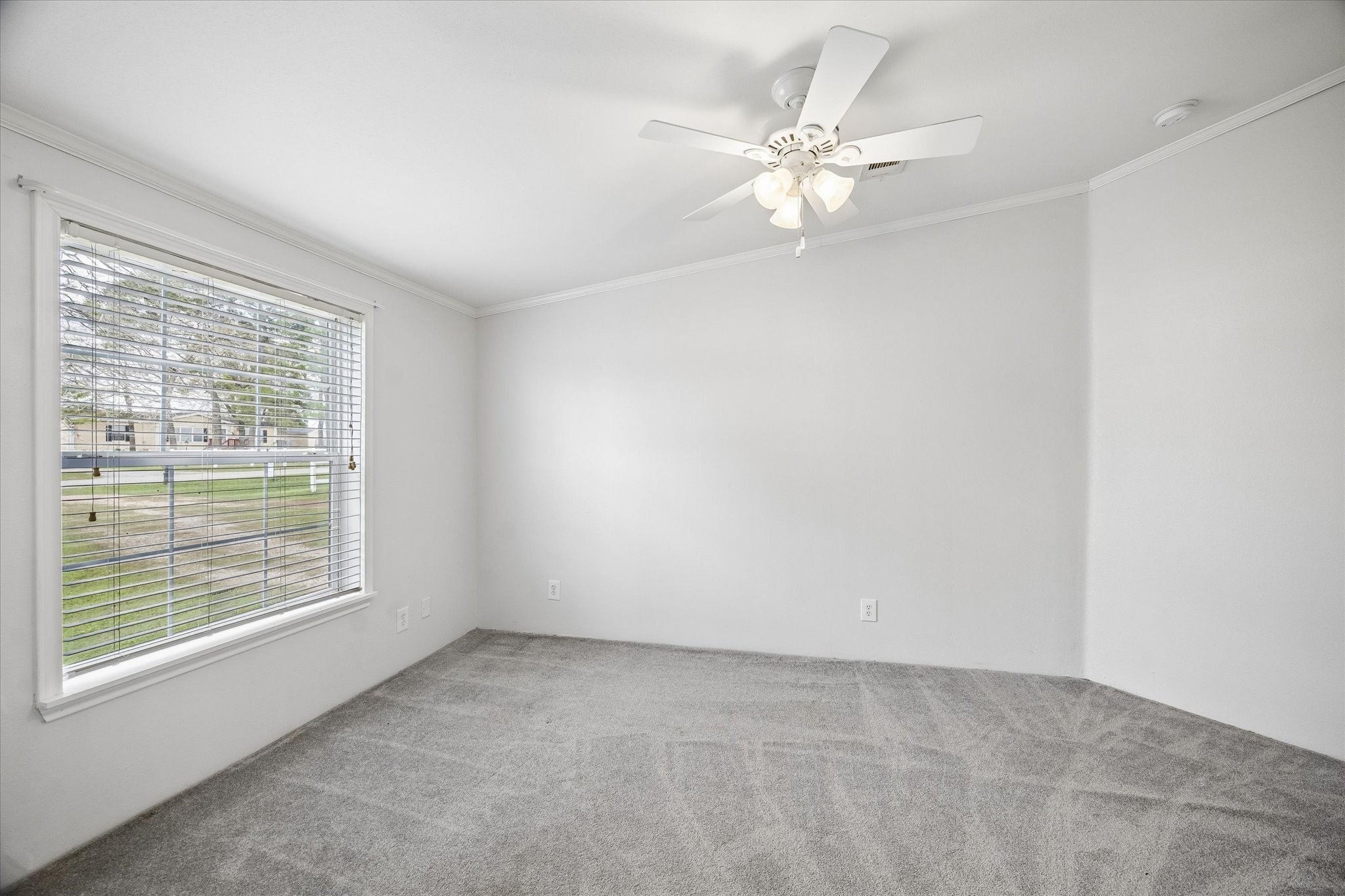 25361 Bluff View Court Magnolia, TX 77355 - Photo 8 of 10 an empty room with windows and fan