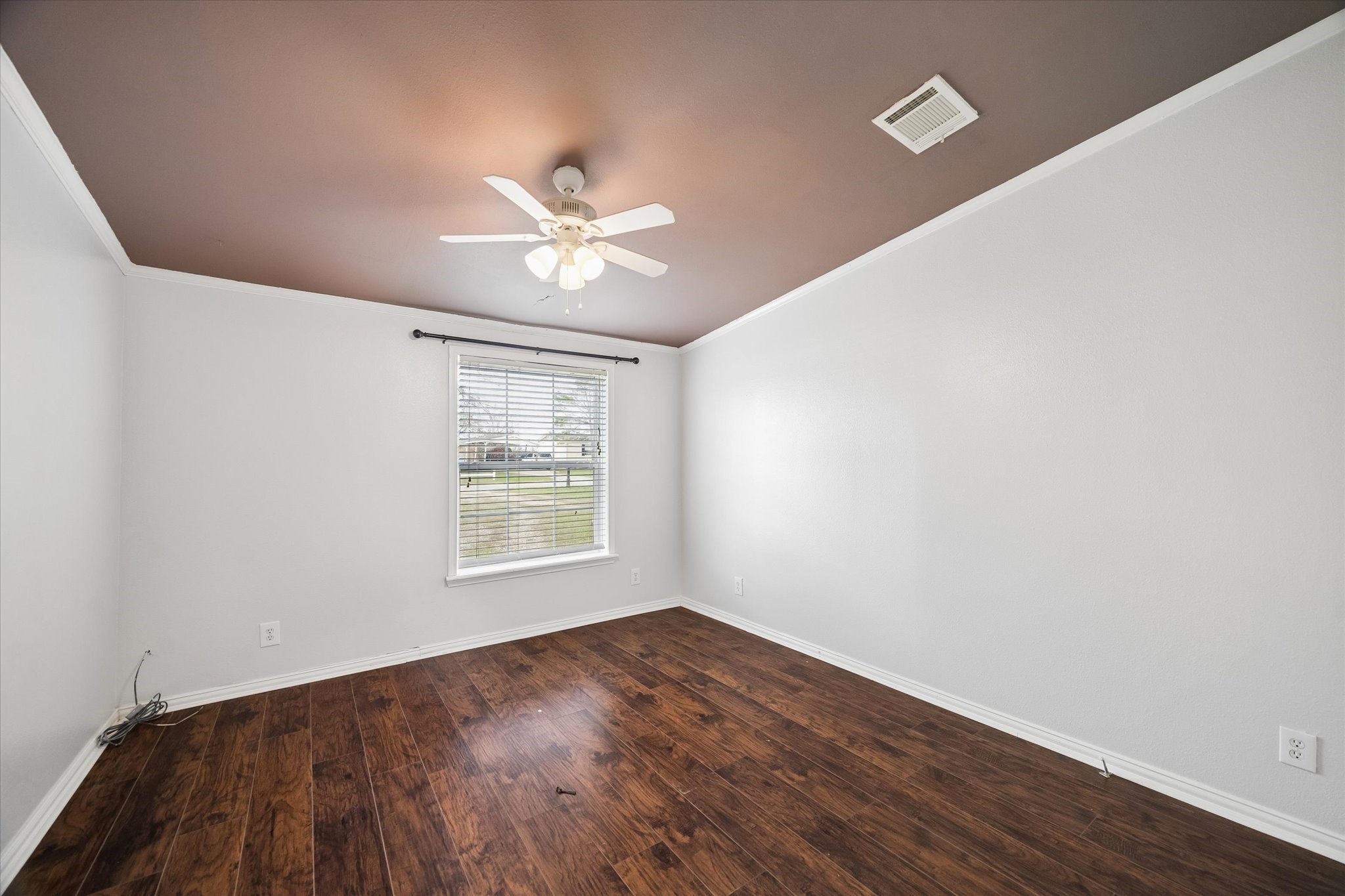 25361 Bluff View Court Magnolia, TX 77355 - Photo 9 of 10 an empty room with wooden floor and windows