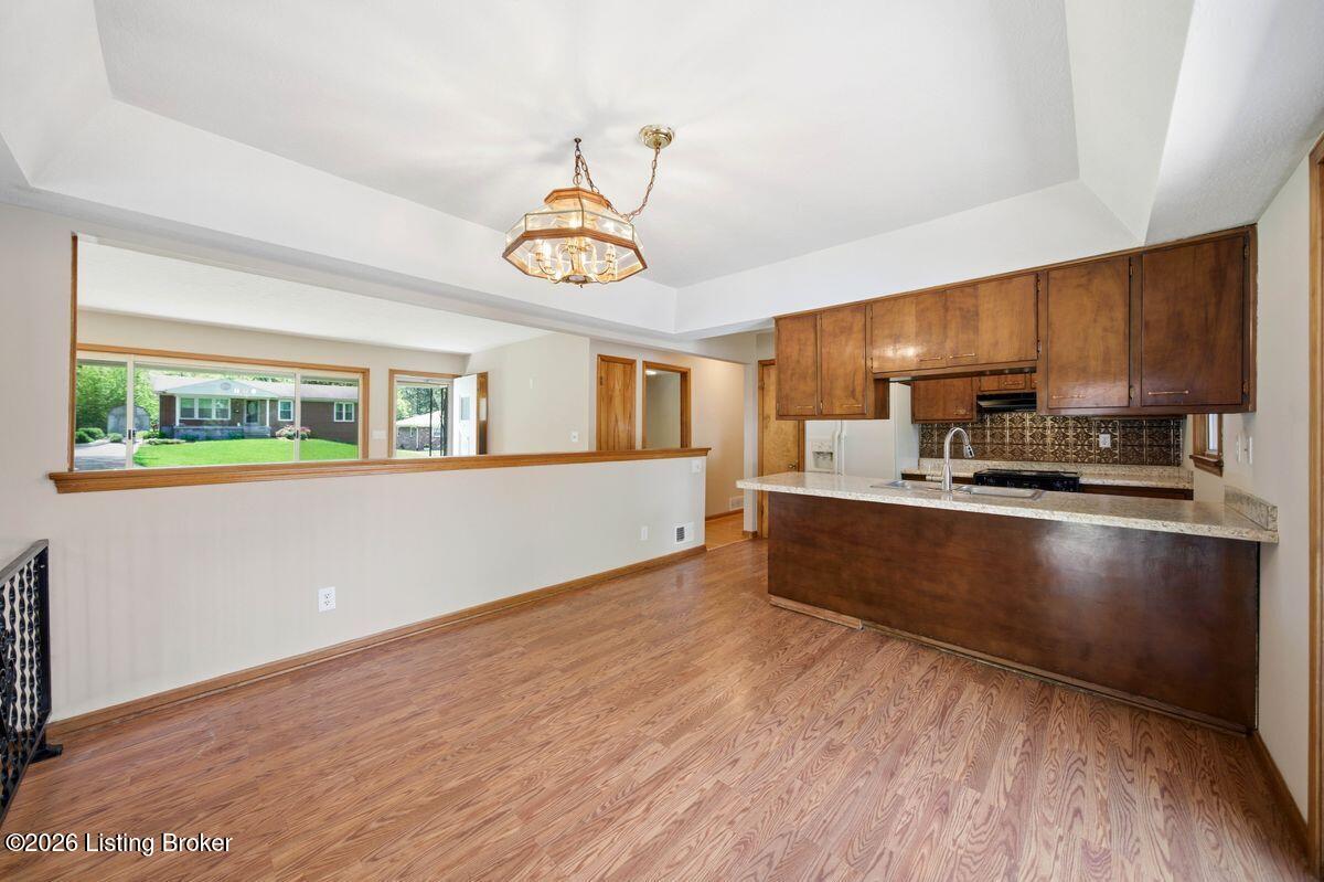 5503 Beth Road Louisville, KY 40219 - Photo 7 of 39 Recently polished laminate flooring