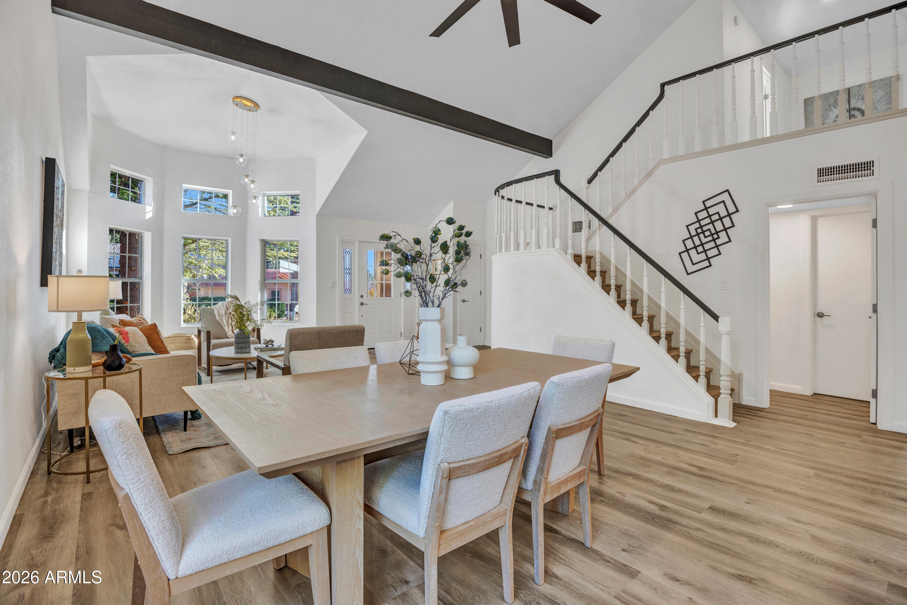 115 Stone Way Sedona, AZ 86351 - Photo 12 of 61 a view of a dining room with furniture and wooden floor