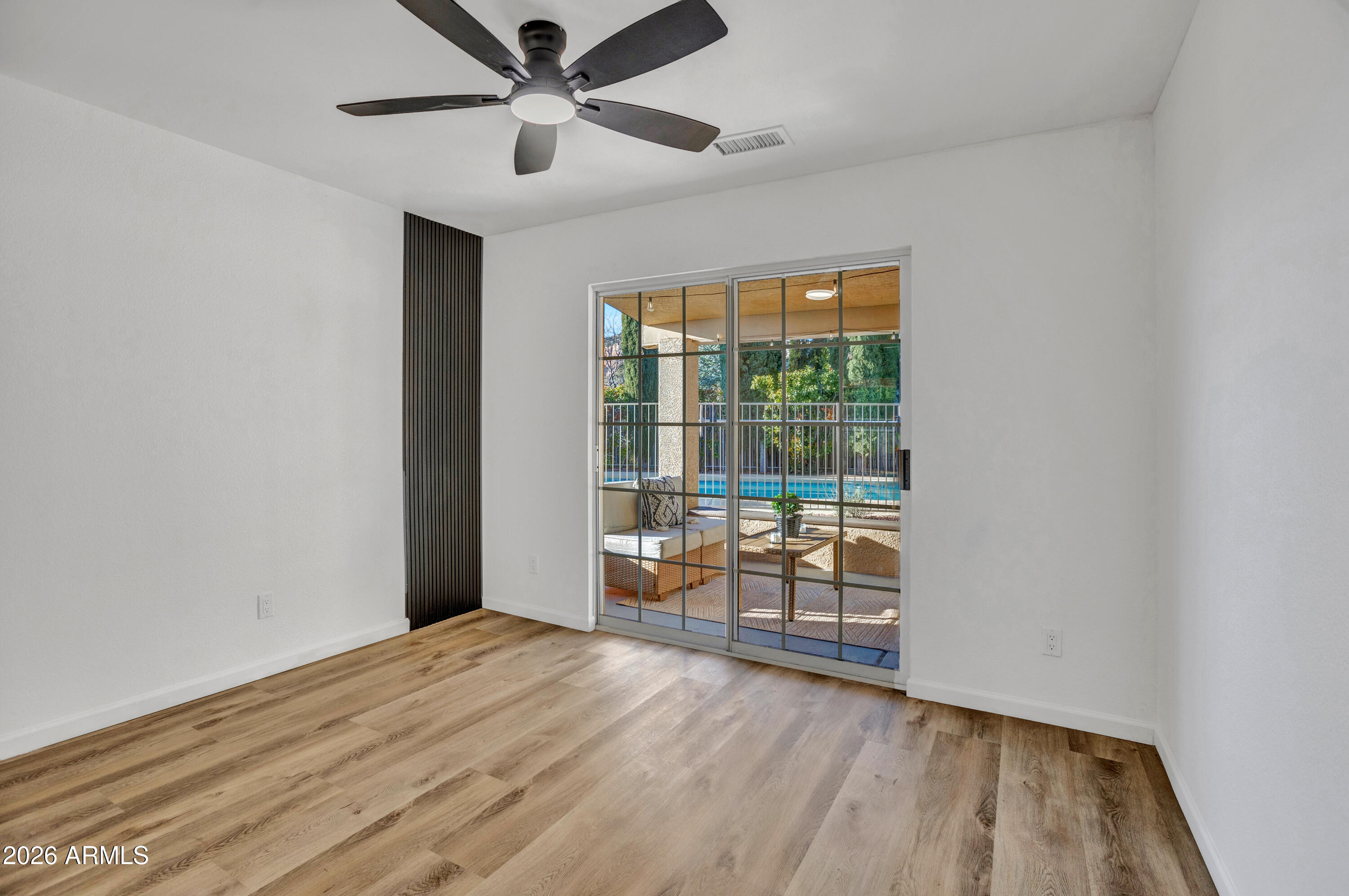 115 Stone Way Sedona, AZ 86351 - Photo 18 of 61 a view of a room with wooden floor and ceiling fan