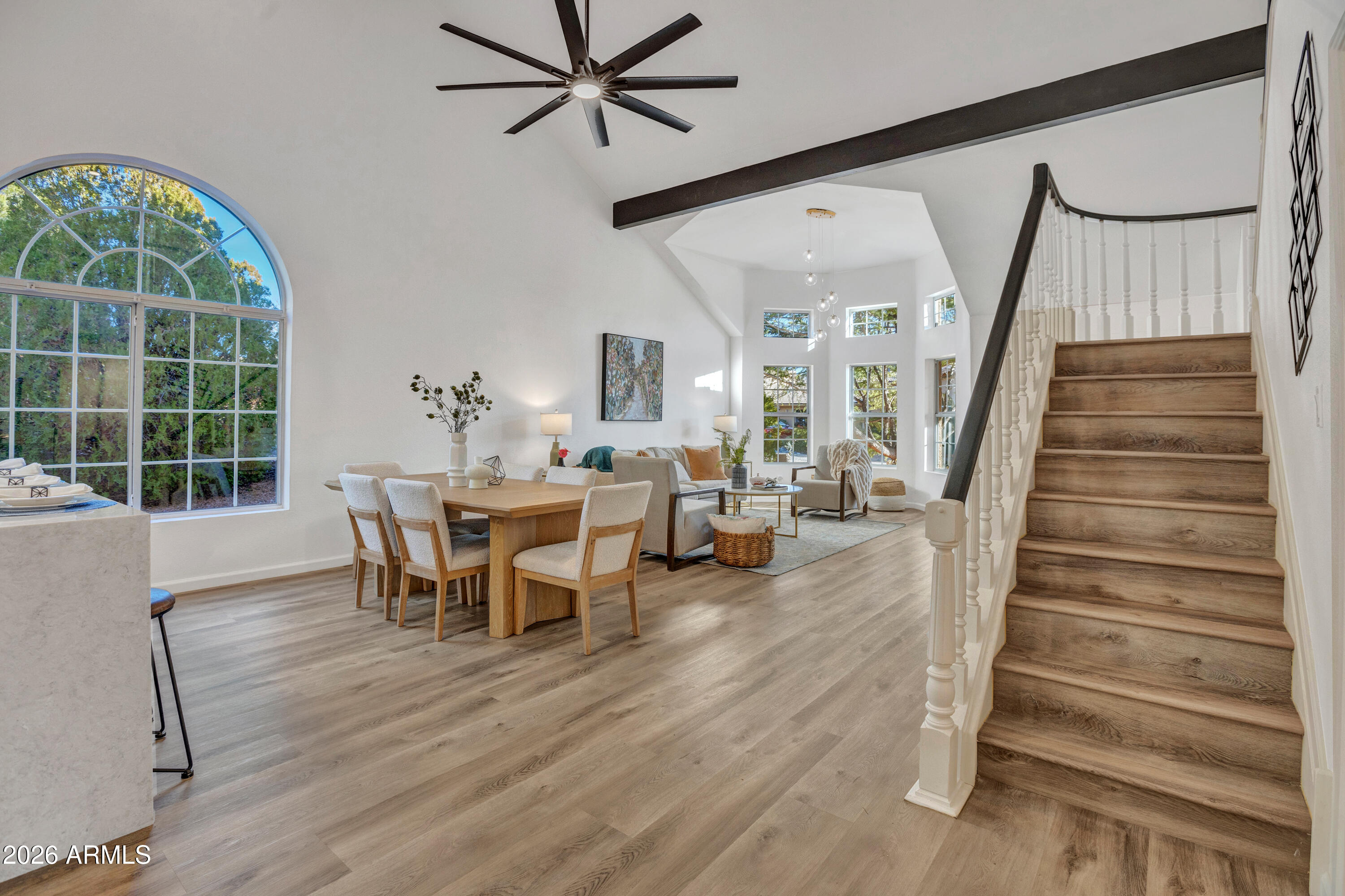 115 Stone Way Sedona, AZ 86351 - Photo 23 of 61 a view of a dining room with furniture window and wooden floor