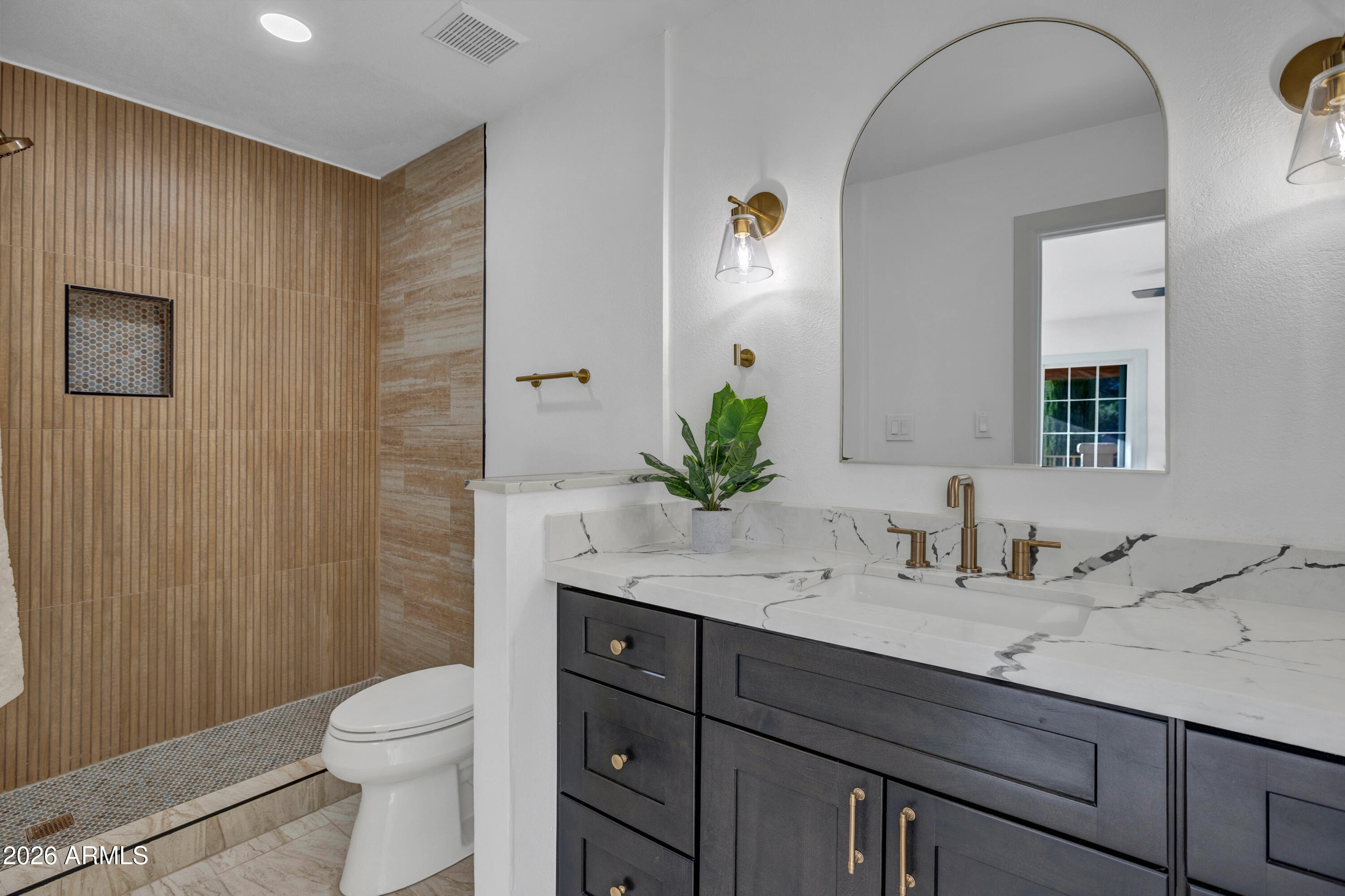 115 Stone Way Sedona, AZ 86351 - Photo 38 of 61 a bathroom with a granite countertop sink a toilet and shower