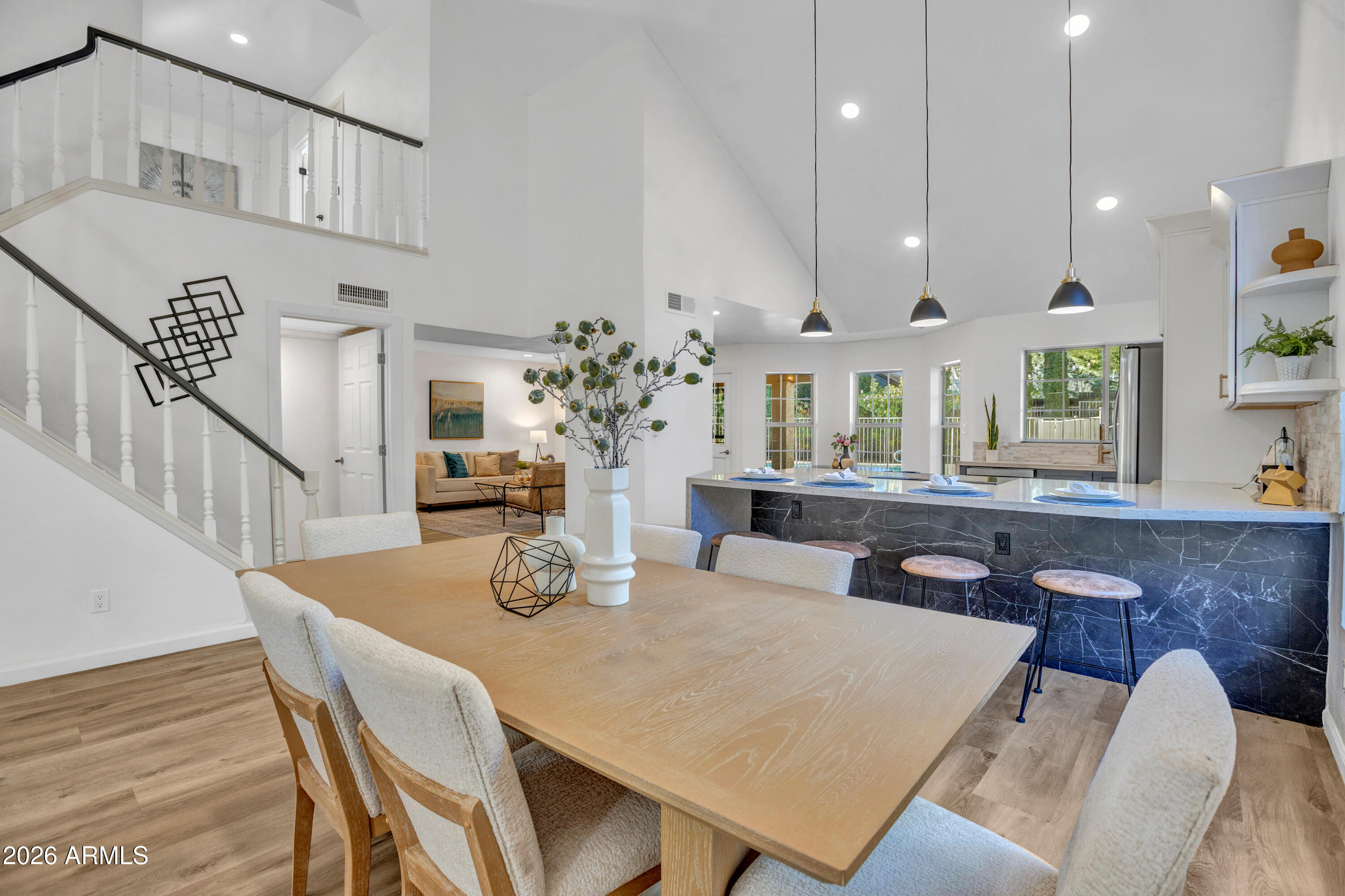115 Stone Way Sedona, AZ 86351 - Photo 6 of 61 a view of a dining room with furniture window and wooden floor