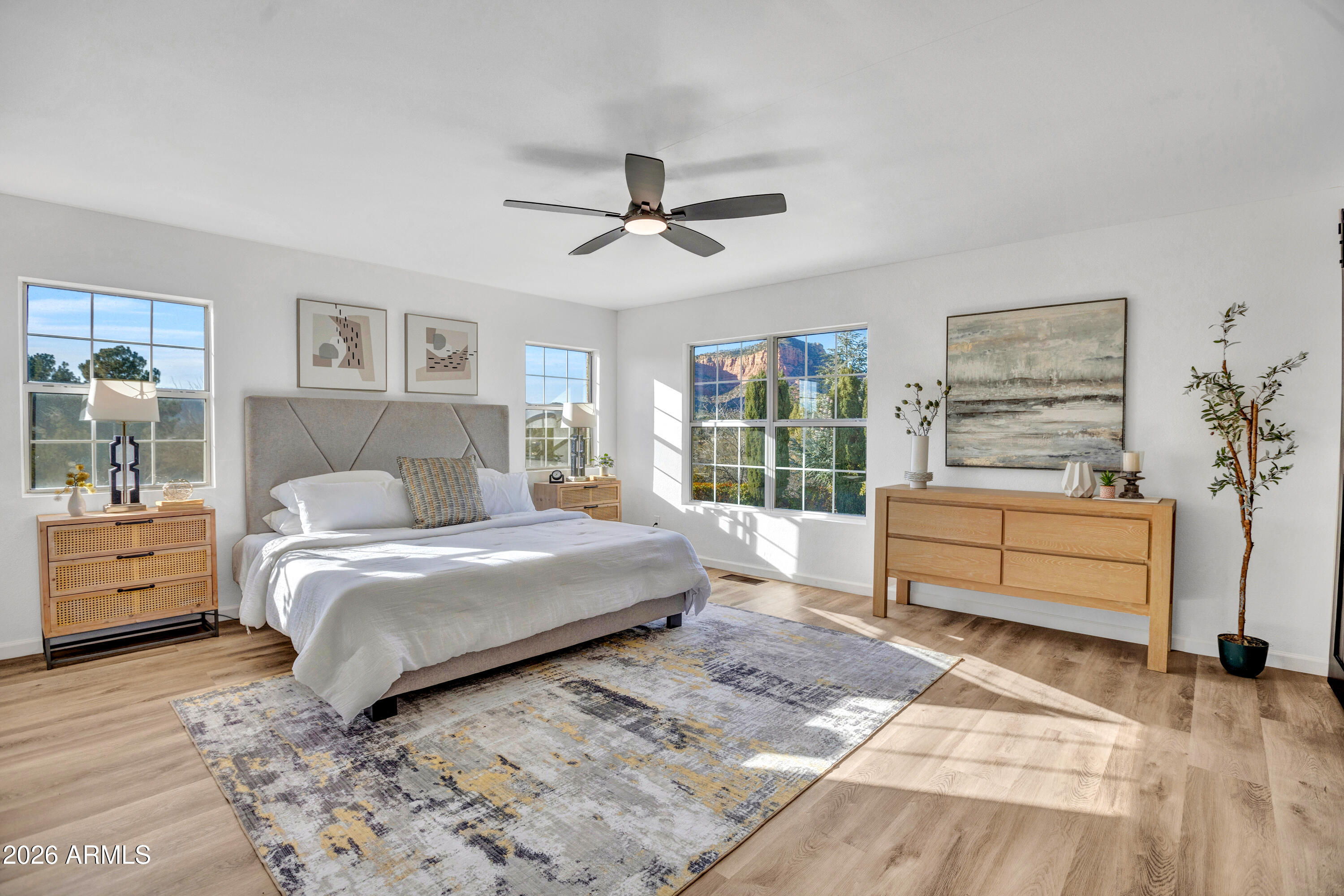 115 Stone Way Sedona, AZ 86351 - Photo 7 of 61 a bedroom with a bed and wooden floor