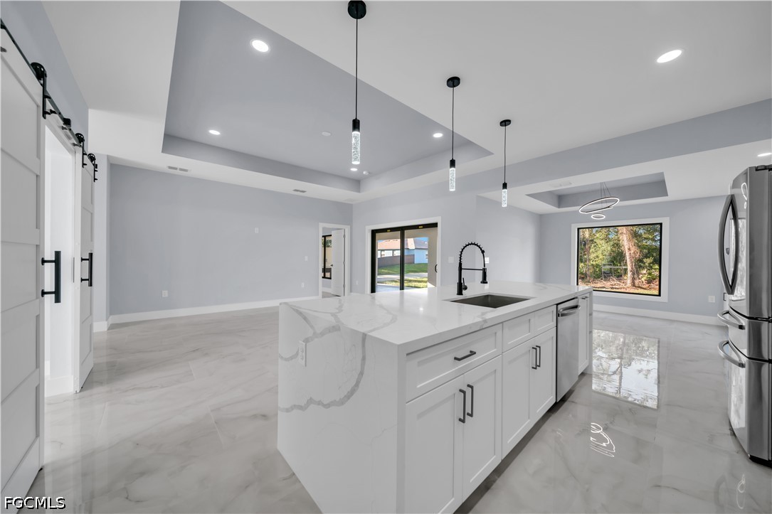 4028 26th Street Southwest Lehigh Acres, FL 33976 - Photo 11 of 38 a bathroom with a double vanity sink a mirror and a shower
