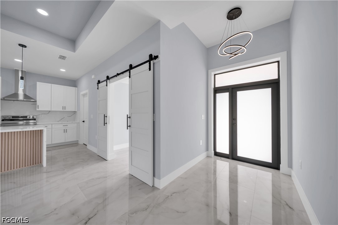 4028 26th Street Southwest Lehigh Acres, FL 33976 - Photo 16 of 38 a view of a kitchen with a fridge and a window