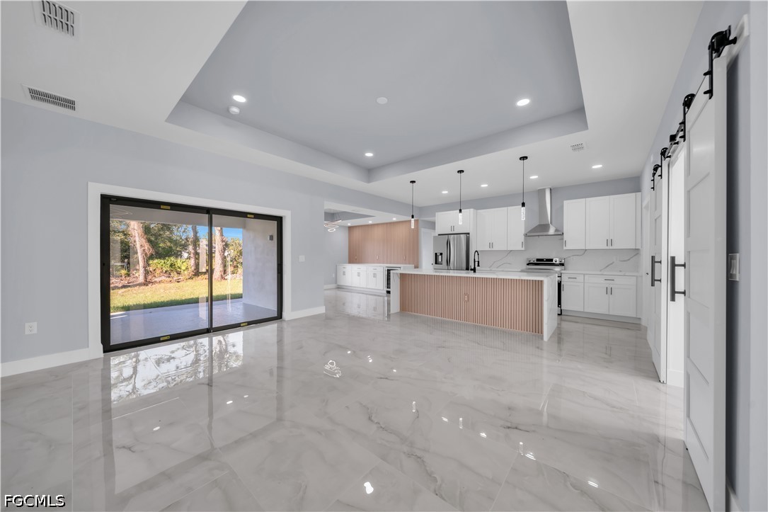 4028 26th Street Southwest Lehigh Acres, FL 33976 - Photo 17 of 38 a view of a kitchen with a sink and cabinets