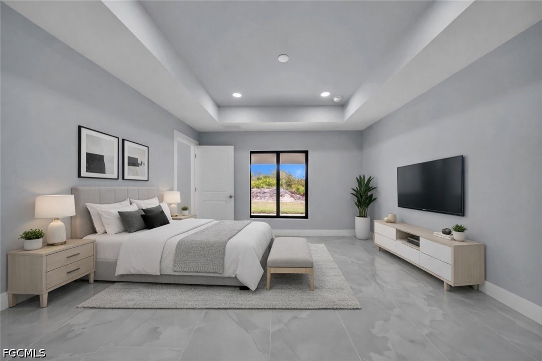 4028 26th Street Southwest Lehigh Acres, FL 33976 - Photo 19 of 38 a hotel room with bed and a flat screen tv