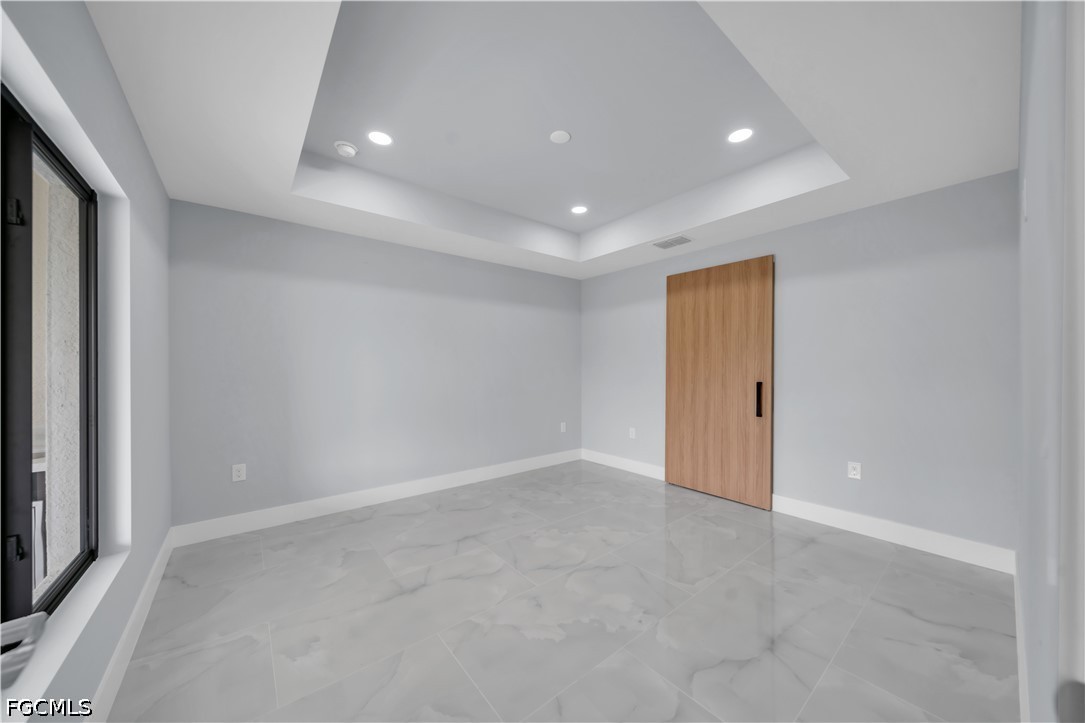 4028 26th Street Southwest Lehigh Acres, FL 33976 - Photo 21 of 38 a view of an empty room