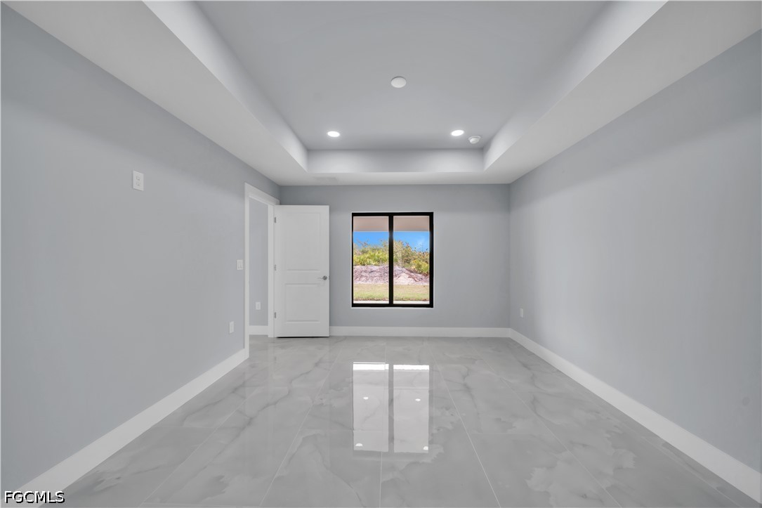 4028 26th Street Southwest Lehigh Acres, FL 33976 - Photo 22 of 38 an empty room with windows