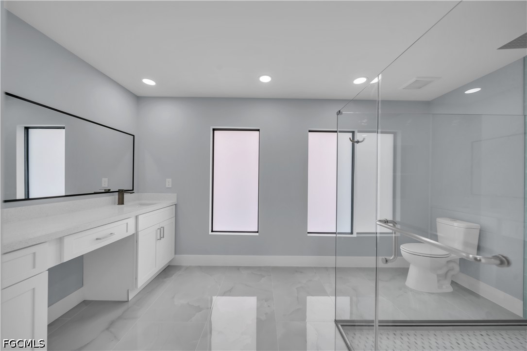 4028 26th Street Southwest Lehigh Acres, FL 33976 - Photo 25 of 38 a bathroom with double vanity and a two mirror