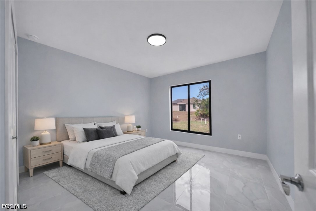 4028 26th Street Southwest Lehigh Acres, FL 33976 - Photo 28 of 38 a bedroom with a bed and a window