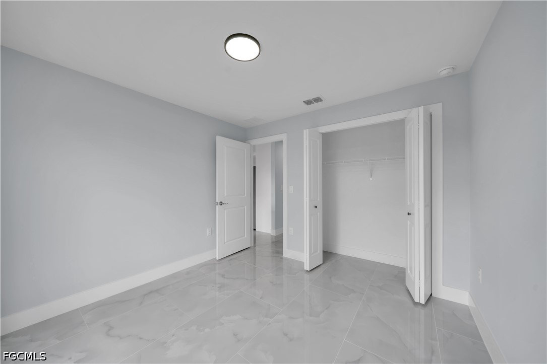 4028 26th Street Southwest Lehigh Acres, FL 33976 - Photo 31 of 38 a view of an empty room