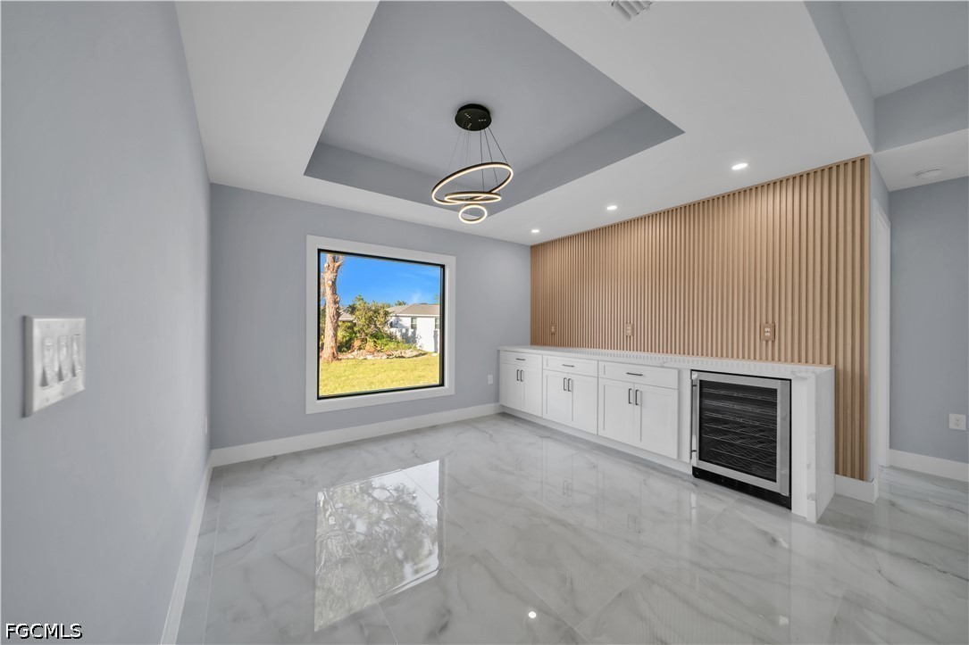 4028 26th Street Southwest Lehigh Acres, FL 33976 - Photo 9 of 38 a view of an empty room with a window and a fireplace